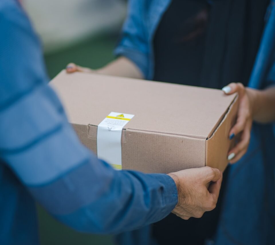 person giving brown box